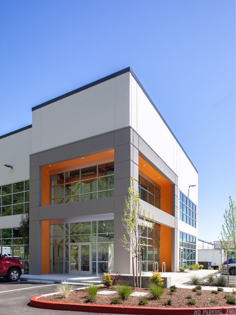 Glass entry of the Sumner Ridge office framed in orange