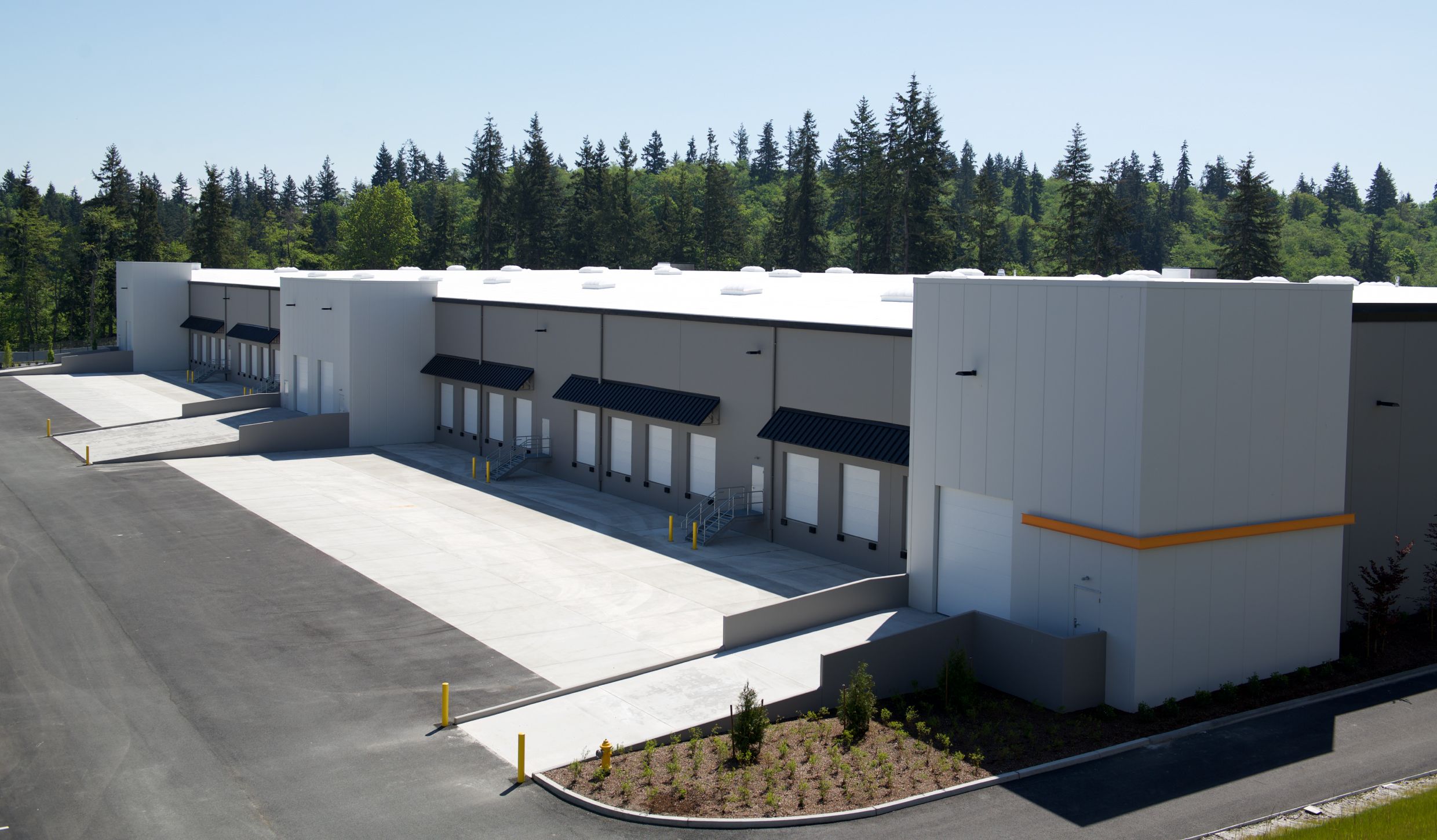 Aerial view of Seaway West's loading docks edged by forest