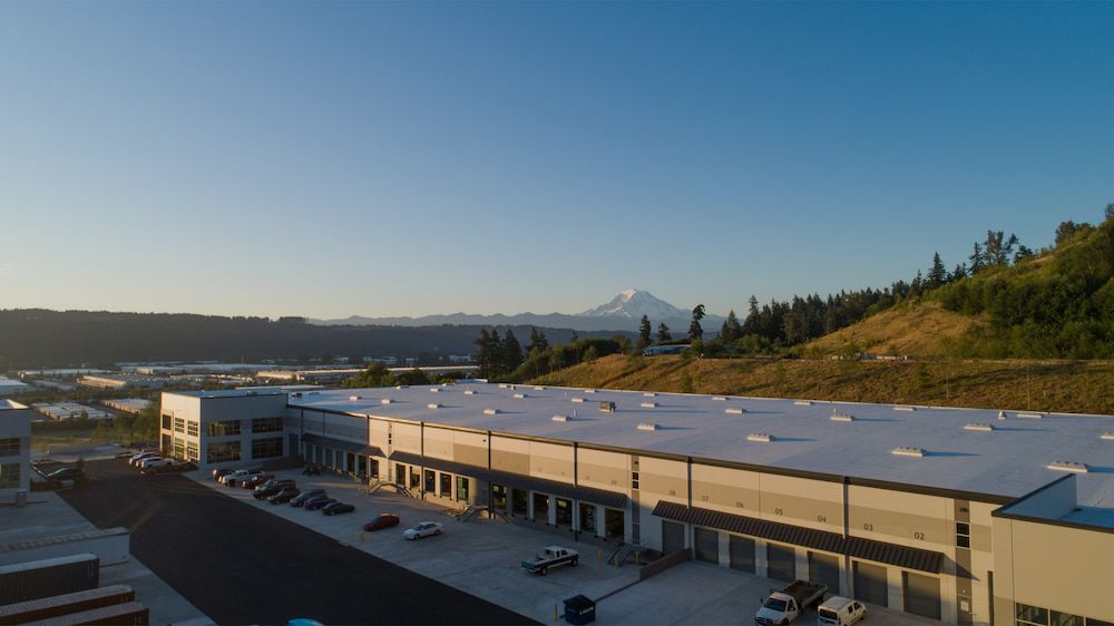 Industrial buildings with Mount Rainier in the distance