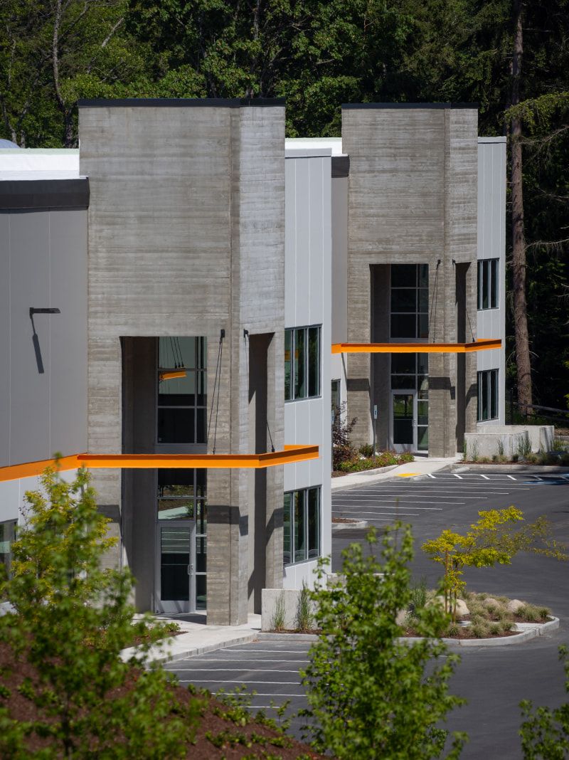 Seaway West's concrete facades set among evergreens